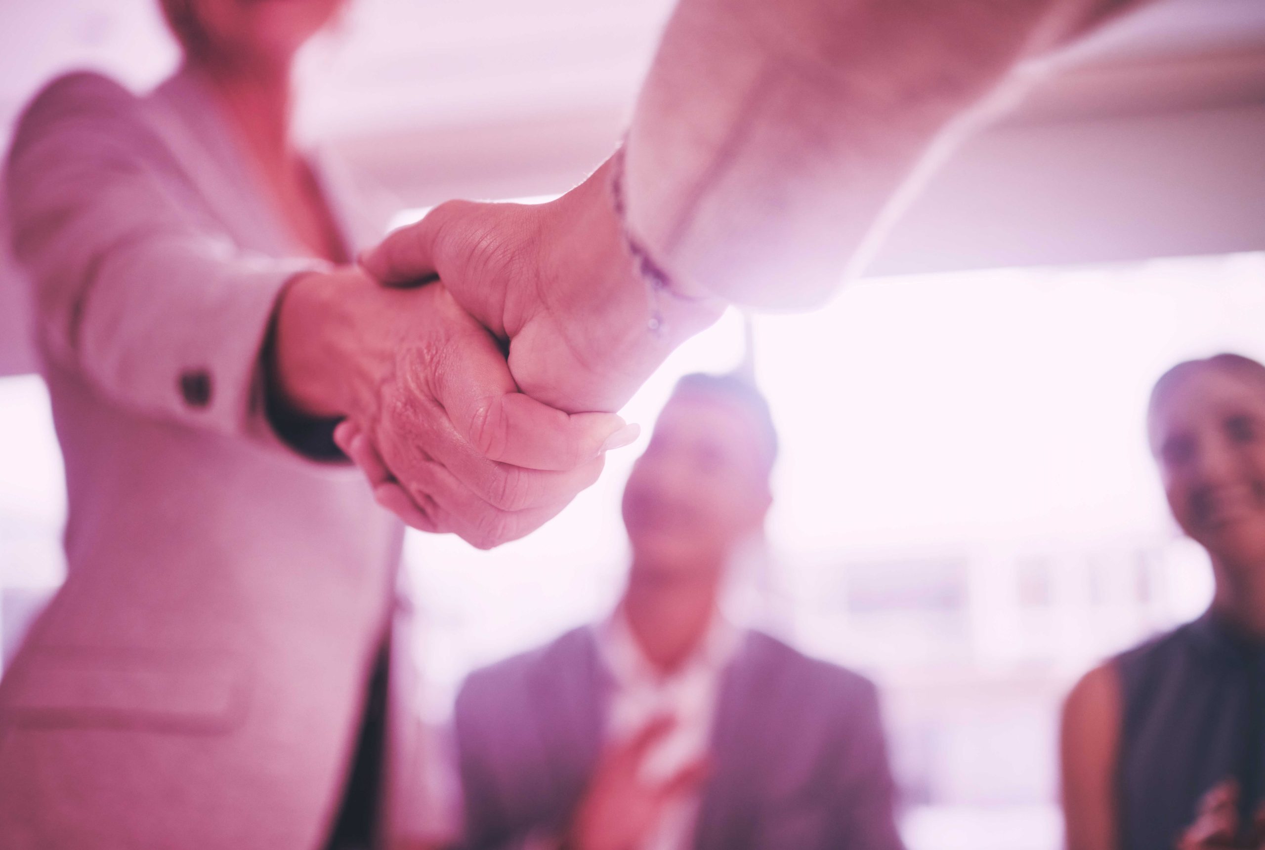 press release header image of corporate handshake business leadership