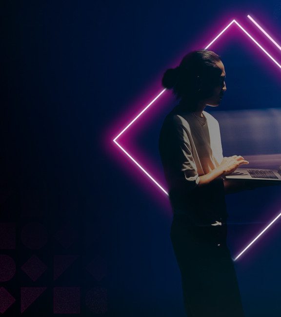 image of person standing with laptop fintech neon shapes