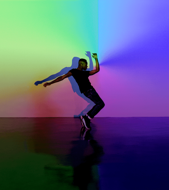 image of man dancing with light and colors