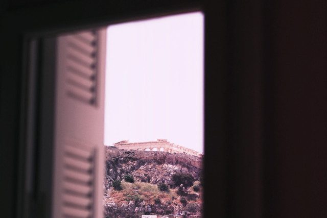The Acropolis in Athens, through a window.