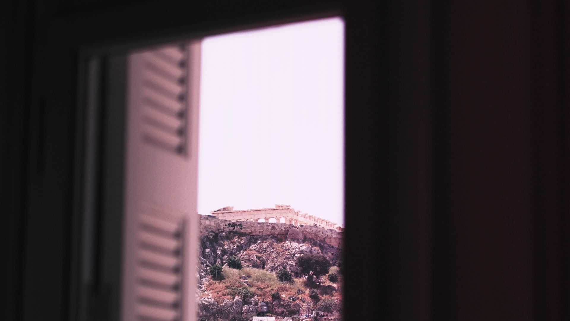 The Acropolis in Athens, through a window.