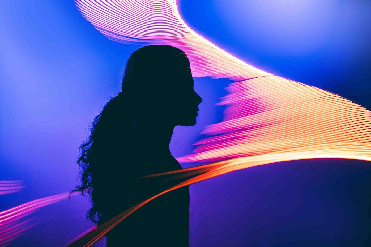 image of anonymous portrait of a human teleporting into a different world with the help of an AI, illuminated by the portal glow, exploring the virtual Universe