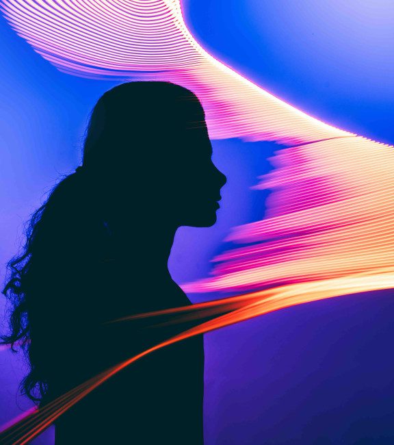 image of anonymous portrait of a human teleporting into a different world with the help of an AI, illuminated by the portal glow, exploring the virtual Universe